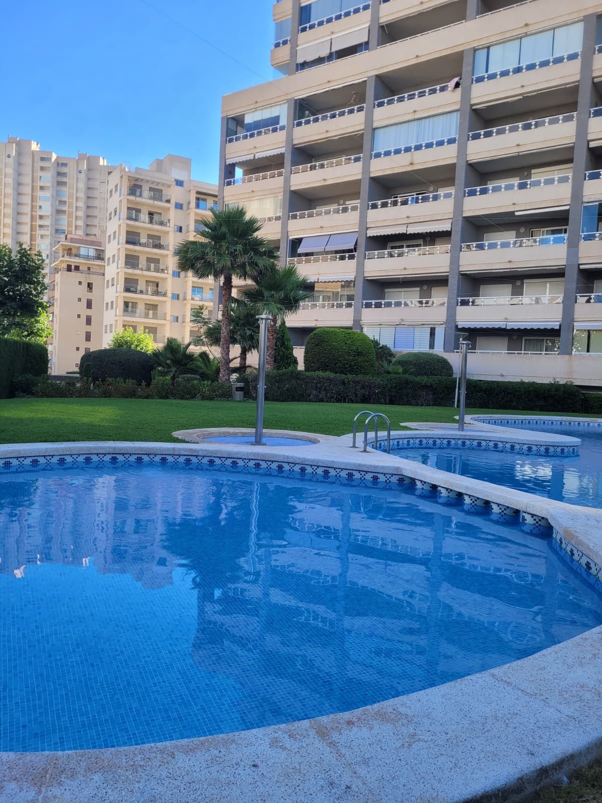 Communal swimming pool with sun loungers
