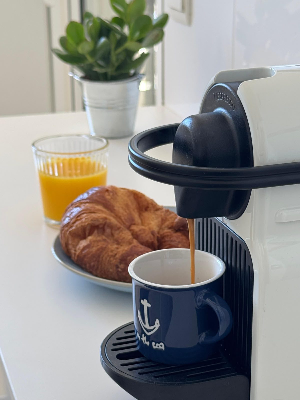 Morning coffee and croissant on the kitchen counter