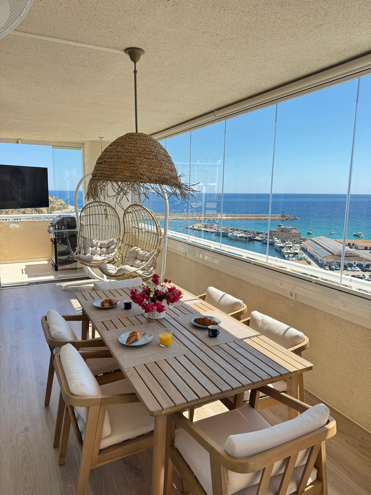 Loggia dining table with harbour view