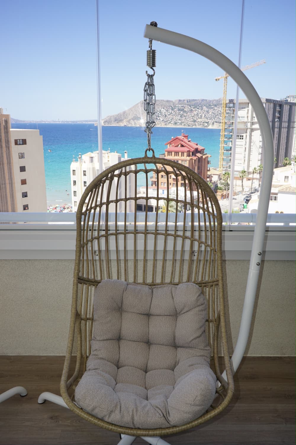 Hanging egg chair with sea view