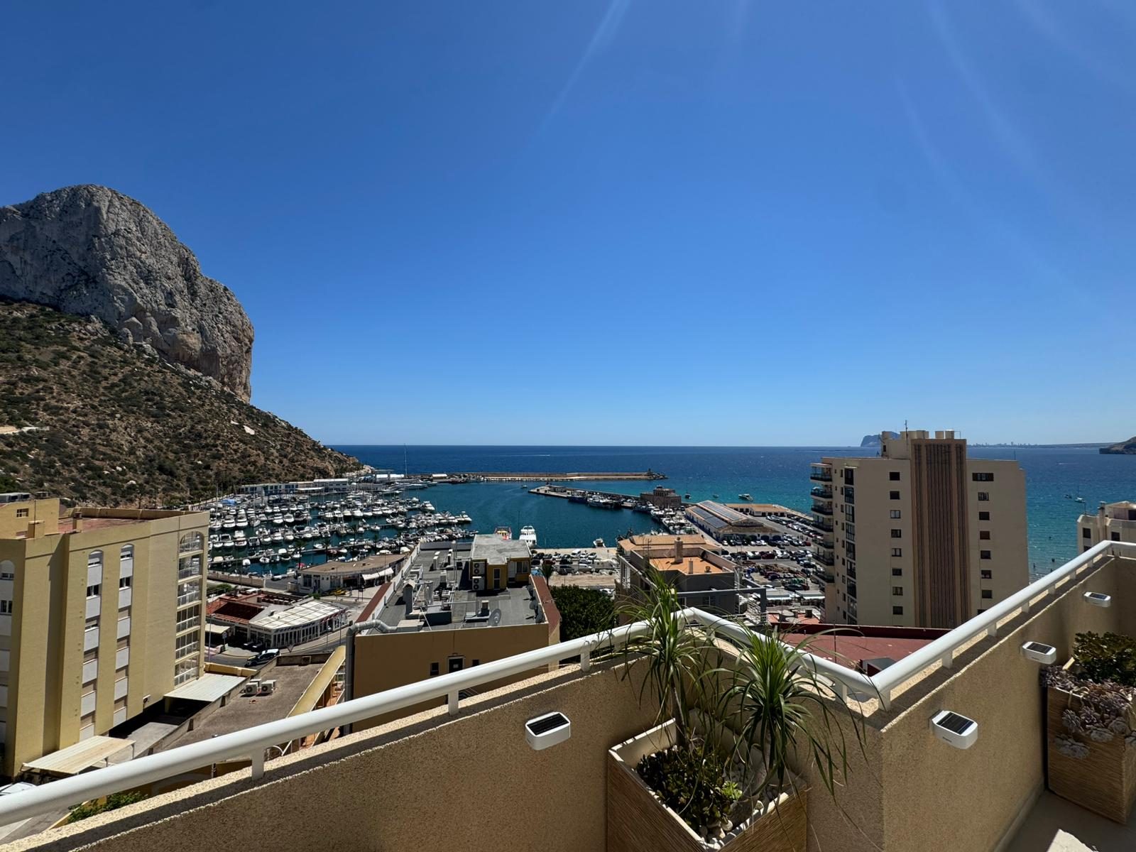 Wide terrace view over the marina with the Peñón de Ifach