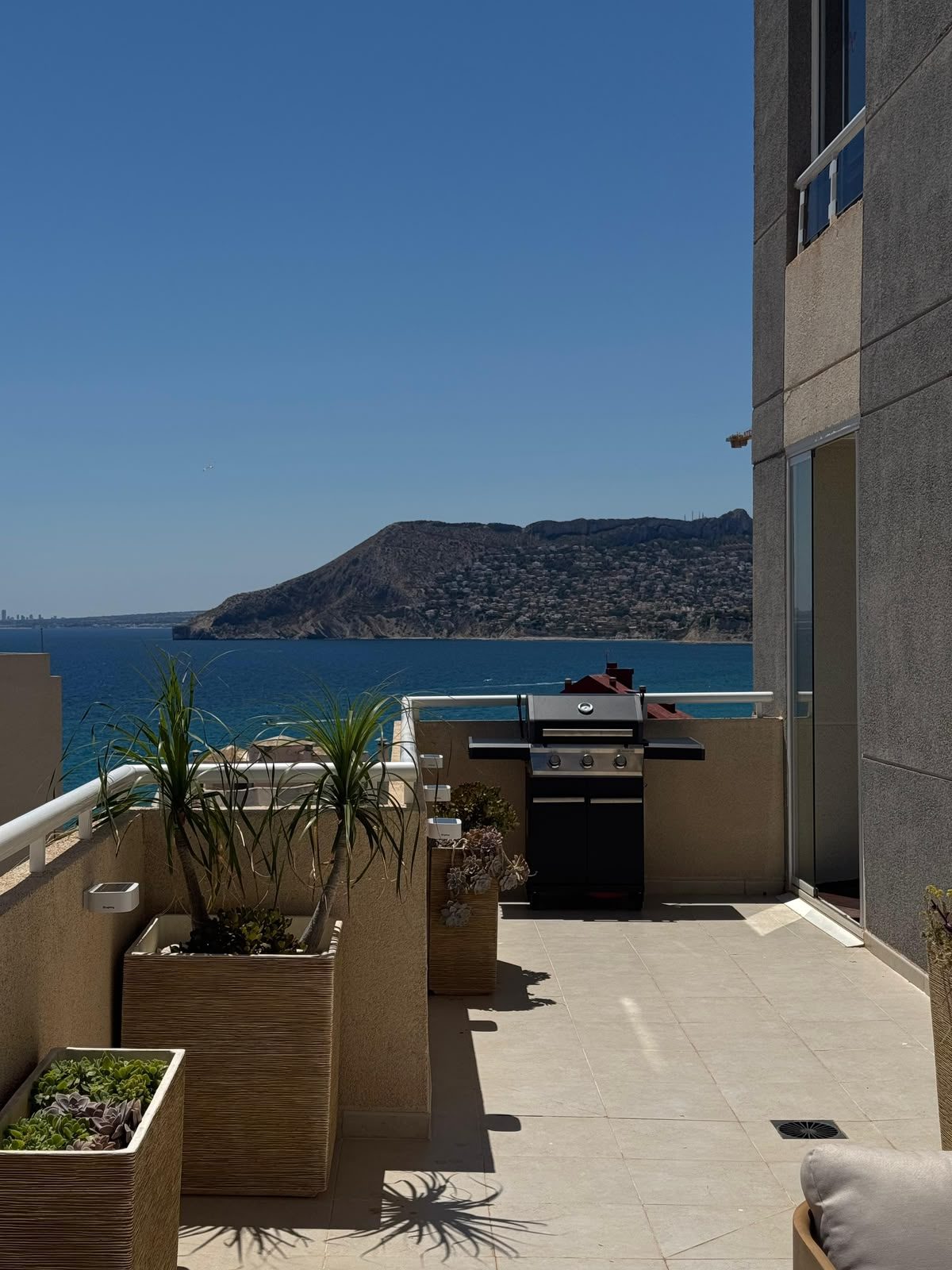 Terrace barbecue area with sea and mountain view